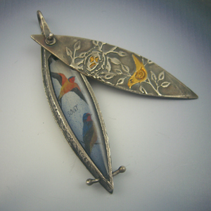 Vickie Hallmark | Soar bird locket, riveted fine silver metal clay with sliding cover and paper in resin